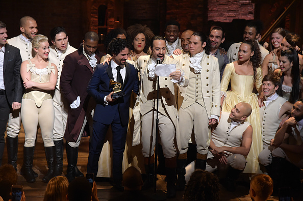 NEW YORK, NY - FEBRUARY 15: Music director Alex Lacamoire and Actor, composer Lin-Manuel Miranda celebrate on stage during "Hamilton" GRAMMY performance for The 58th GRAMMY Awards at Richard Rodgers Theater on February 15, 2016 in New York City. 